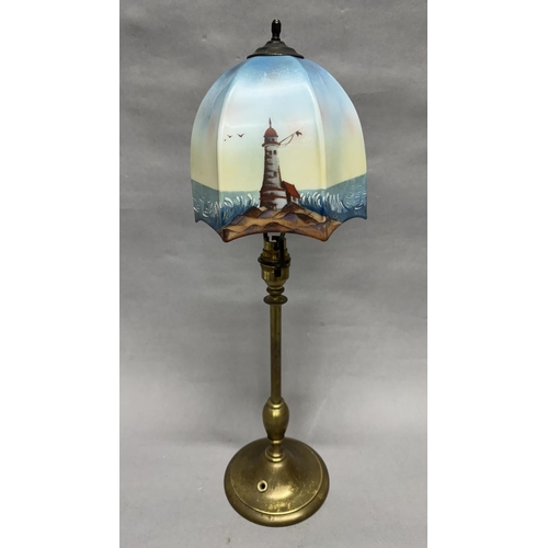 91 - An early 20th century brass table lamp, on a circular spreading foot, with an associated hexagonal g... 