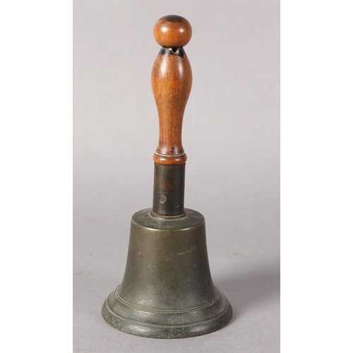 85 - An early 20th century handbell with turned wood handle, 26.5cm high together with a vintage cowboy's... 