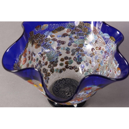 17 - A Murano millefiori murrina glass vase, the folded rim with border and drips in blue glass and on bl... 