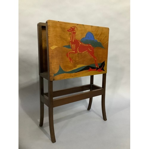 39 - An Art Deco magazine rack, the plywood sides each painted with a leaping antelope against a landscap... 