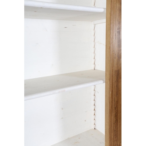 112 - A stained wood open bookcase of architectural design, the inverted breakfront with stepped cornice a... 