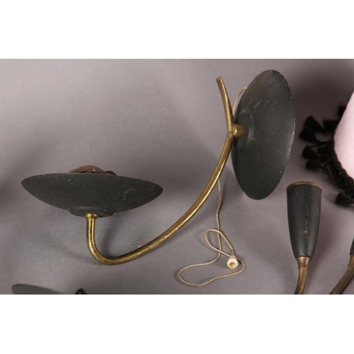 87 - A pair of late 1950s/early 1960s black enamelled and gilt metal wall sconces of dished form, approxi... 