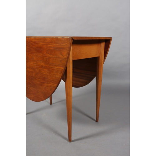 309 - A small teak oval drop leaf dining table, on octagonal and tapered legs, 145cm x 83.5cm