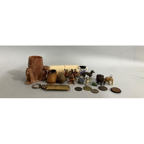 179 - A collection of painted lead and carved wooden miniature animals, a set of four miniature ceramic or... 