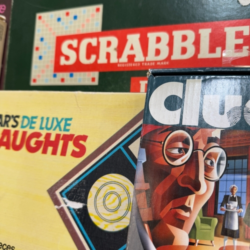 59 - A box of vintage and later games including Mastermind, Cluedo, Monopoly etc