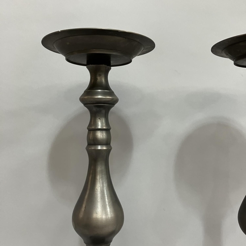 4 - A large pair of pewter finish candlesticks, baluster columns and stepped circular bases, 50.5cm high