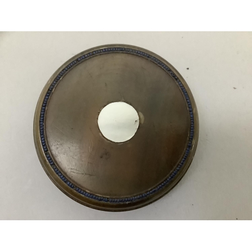 38 - A late 18th/early 19th century horn snuff box, circular, inlaid to the cover with mother of pearl to... 