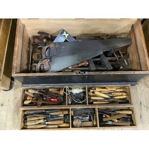 An ebonised pine tool chest containing a large quantity of antique and ...