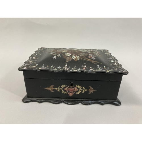 15 - A Victorian papier mache, mother-of-pearl inlaid work box having semi-domed lid of bracketed outline... 