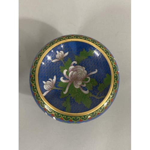 37 - A Chinese cloisonné lidded bowl and a pair of miniature vases each worked with peony and other bloss... 