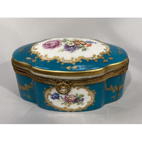 9 - A Limoges porcelain and gilt metal casket of panelled oval form, the domed cover poly-chrome enamell... 