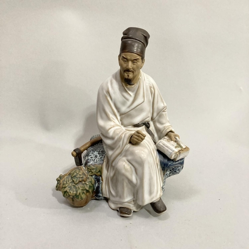 41 - Two Shiwan pottery figures of Li Shizhen Chinese herbalist together with a figure of a man seated on... 