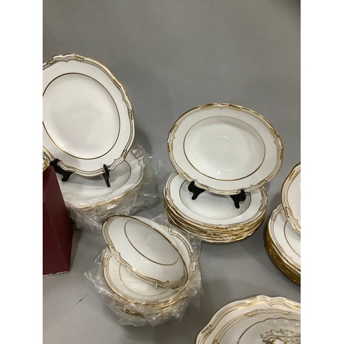 1 - A Spode fine bone china dinner service of Sheffield design, white with gilt rim for eight place sett... 