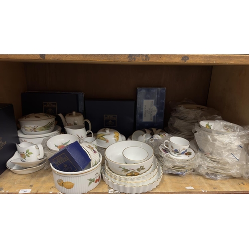 59 - An extensive Royal Worcester Evesham dinner service for eight having plates in four sizes, bowls in ... 