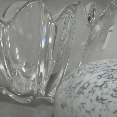 57 - An Orrefors clear glass bowl of flower form together with a a clear and white speckled glass tealigh... 