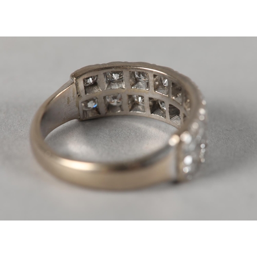 440 - A DIAMOND SET RING, the brilliant cut stone grain set in two lines in white metal (tests as 18ct gol... 