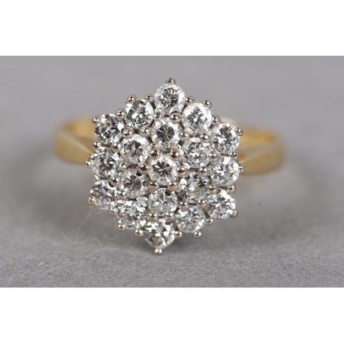 437 - A DIAMOND CLUSTER RING, the brilliant cut stones claw set within an hexagonal outline, finger size O... 