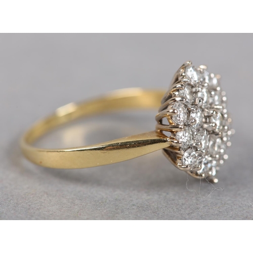 437 - A DIAMOND CLUSTER RING, the brilliant cut stones claw set within an hexagonal outline, finger size O... 