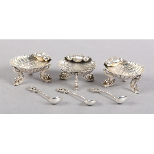 371 - A SET OF THREE VICTORIAN SILVER SHELL SALT CELLARS, Birmingham 1866 for George Unite, each on three ... 