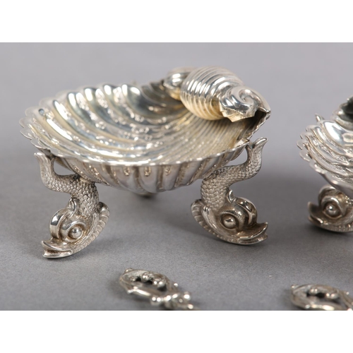 371 - A SET OF THREE VICTORIAN SILVER SHELL SALT CELLARS, Birmingham 1866 for George Unite, each on three ... 