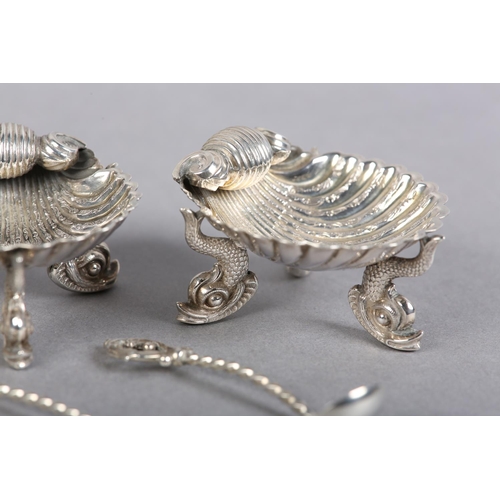 371 - A SET OF THREE VICTORIAN SILVER SHELL SALT CELLARS, Birmingham 1866 for George Unite, each on three ... 