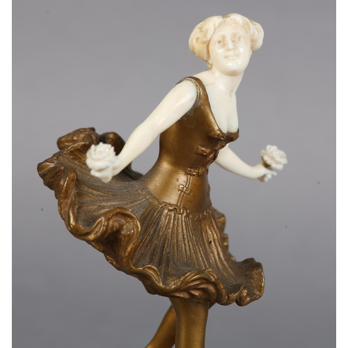 63 - EUGÈNE VICTOR (act. 1900-1930), Art Deco gilded bronze and ivory figure of a dancer holding a rose i... 