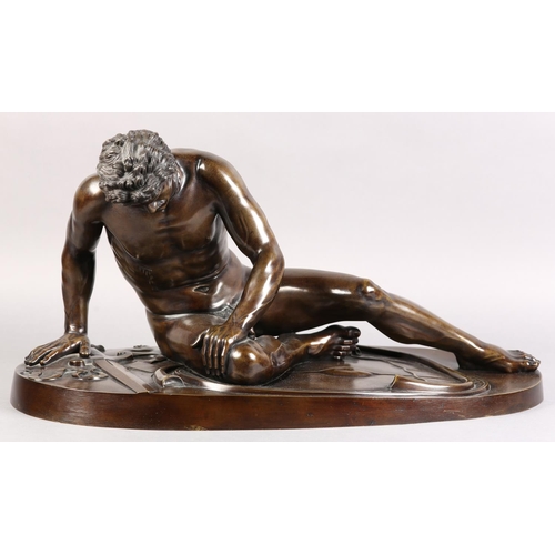 67 - A 19TH CENTURY ITALIAN BRONZE FIGURE OF THE DYING GAUL, after the antique, fallen, his broken sword ... 