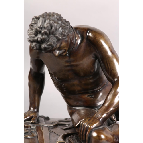 67 - A 19TH CENTURY ITALIAN BRONZE FIGURE OF THE DYING GAUL, after the antique, fallen, his broken sword ... 