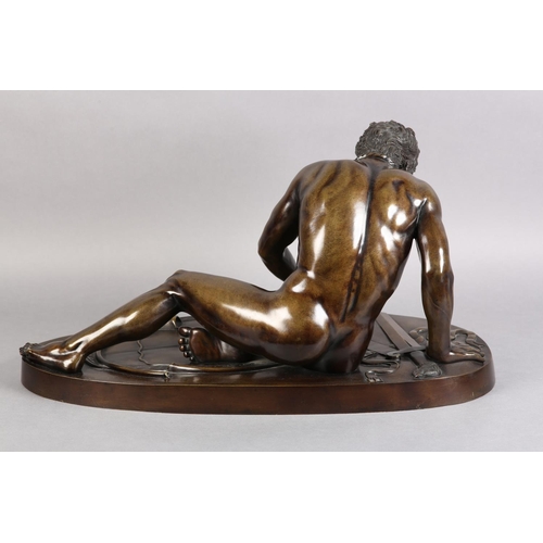 67 - A 19TH CENTURY ITALIAN BRONZE FIGURE OF THE DYING GAUL, after the antique, fallen, his broken sword ... 