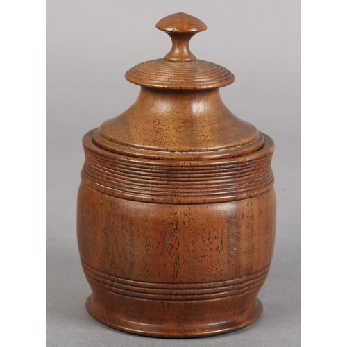 74 - AN EARLY 19TH CENTURY WALNUT TOBACCO JAR AND COVER with knop finial and reeded banding, 14cm high