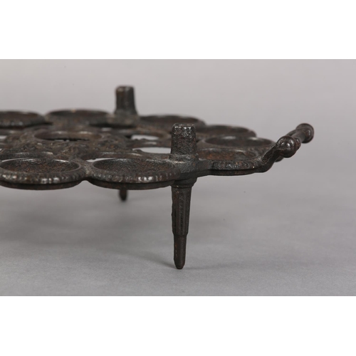 11 - A 19TH CENTURY CAST IRON EGG STAND made in Germany for the Diary Supply Co Ltd, of circular outline ... 