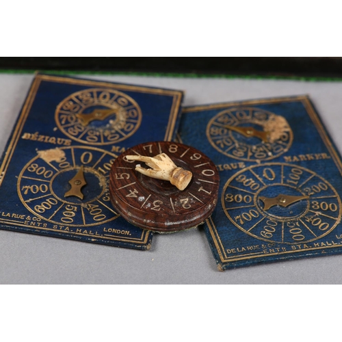 68 - A VICTORIAN WALNUT GAMES COMPENDIUM, with cut brass strapwork and escutcheon, the interior fitted wi... 