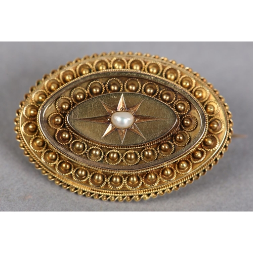 405 - A VICTORIAN SEED PEARL, marquise shaped shield brooch in 15ct gold, the single pearl star set, raise... 