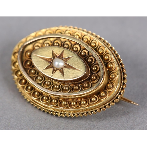 405 - A VICTORIAN SEED PEARL, marquise shaped shield brooch in 15ct gold, the single pearl star set, raise... 
