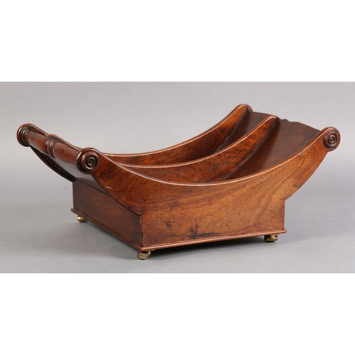 72 - A GEORGE III MAHOGANY CHEESE COASTER, of typical boat form, divided interior, on four leather bound ... 