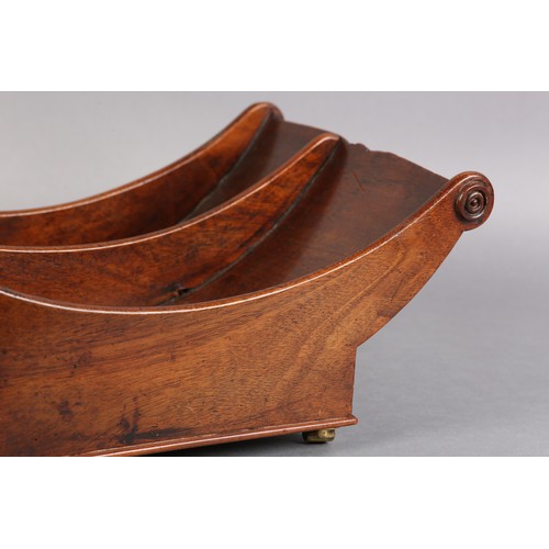 72 - A GEORGE III MAHOGANY CHEESE COASTER, of typical boat form, divided interior, on four leather bound ... 