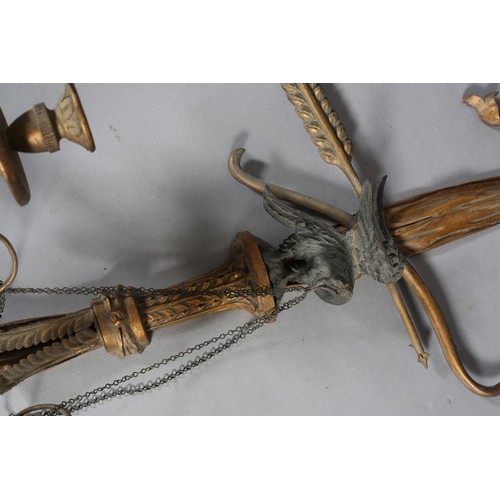 498 - A PAIR OF REGENCY GILTWOOD CANDLE SCONCES, the ribbon-tied drapes with tassels, crossed bow and arro... 