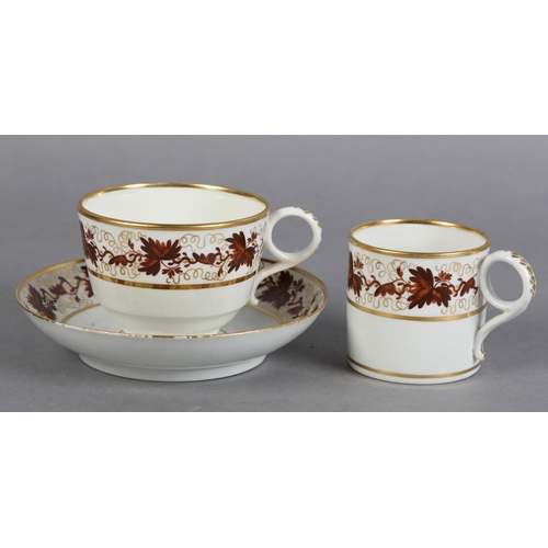 83 - A WORCESTER BARR PORCELAIN TRIO 1792-1807 of tea cup, coffee can and saucer, painted in brown with t... 