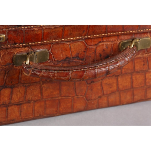 29 - MAPPIN & WEBB LTD, Oxford St London, An early 20th century crocodile skin suitcase, green silk linin... 