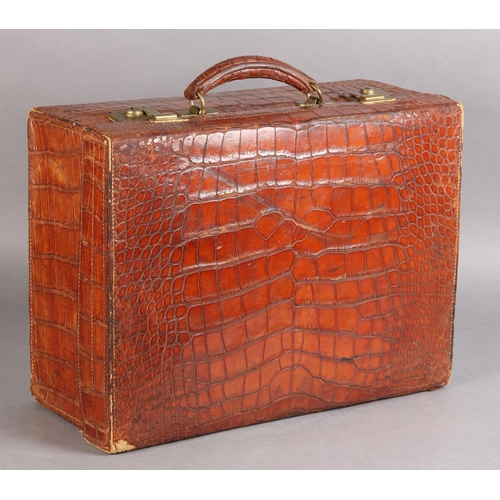 29 - MAPPIN & WEBB LTD, Oxford St London, An early 20th century crocodile skin suitcase, green silk linin... 