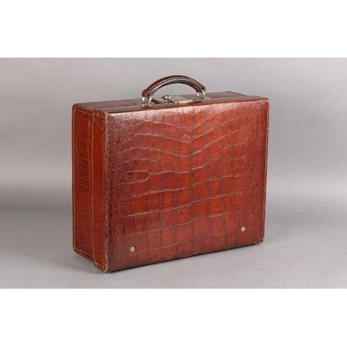 30 - AN EARLY TO MID 20TH CENTURY CROCODILE SKIN SUITCASE, mid blue silk lining with pouch to lid, polish... 