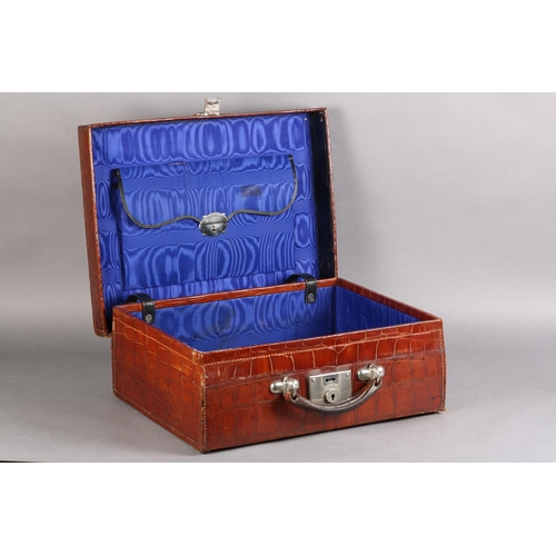 30 - AN EARLY TO MID 20TH CENTURY CROCODILE SKIN SUITCASE, mid blue silk lining with pouch to lid, polish... 