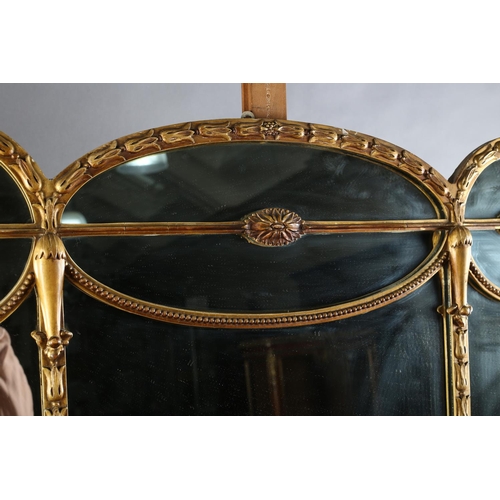 496 - AN EDWARD VII GILTWOOD AND GESSO OVERMANTEL MIRROR, of triple arched profile and panels with harebel... 