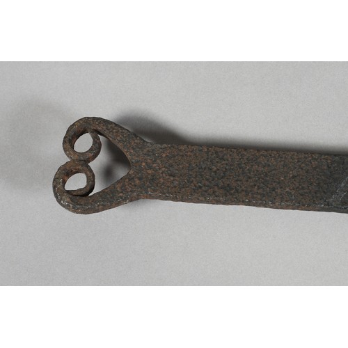 14 - A 19TH CENTURY LONG HANDLED CAST IRON BREAD PEEL with double scroll terminal, 154cm long