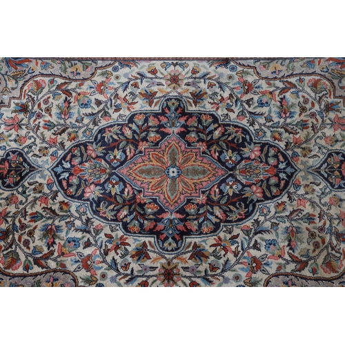 492 - A KASHMIR RUG, Pakistan/North India border region, mid 20th century, wool, the ivory field, central ... 