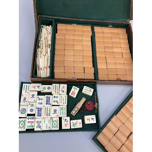 58 - A bamboo and bone mahjong set in a small case with three baize lined trays purchased in Rangoon in 1... 