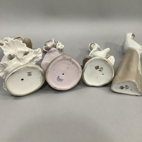 1000 - Three Nao figures and a Nadal figure of girls variously with chicken, rabbit, cat