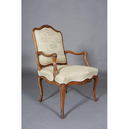 315 - AN 18TH CENTURY FRENCH ELM ELBOW CHAIR, having an encircling moulded frame, carved with leafage, arc... 