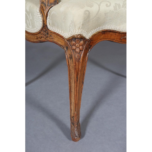 315 - AN 18TH CENTURY FRENCH ELM ELBOW CHAIR, having an encircling moulded frame, carved with leafage, arc... 