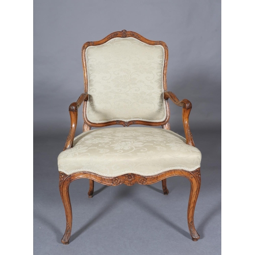 315 - AN 18TH CENTURY FRENCH ELM ELBOW CHAIR, having an encircling moulded frame, carved with leafage, arc... 